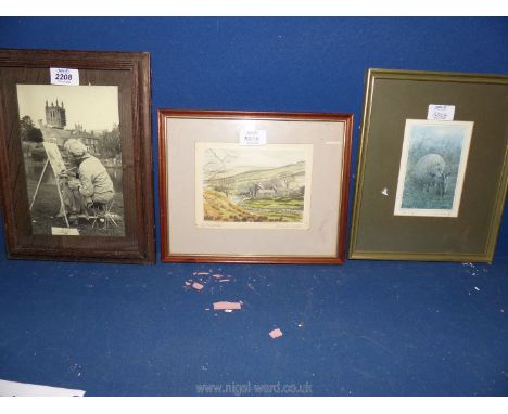 A wooden framed photo of an Artist at work, a framed and mounted print of Coverdale by Isobel Shaw and a limited edition prin
