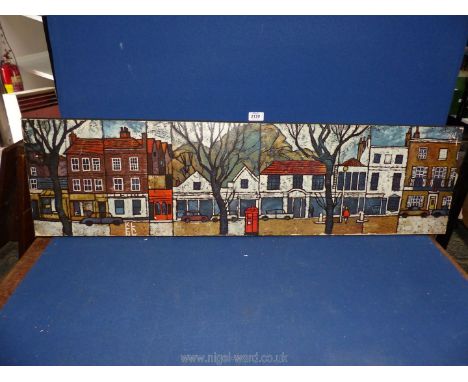 A Ken Law Print on board depicting a street scene, 43 x 12".