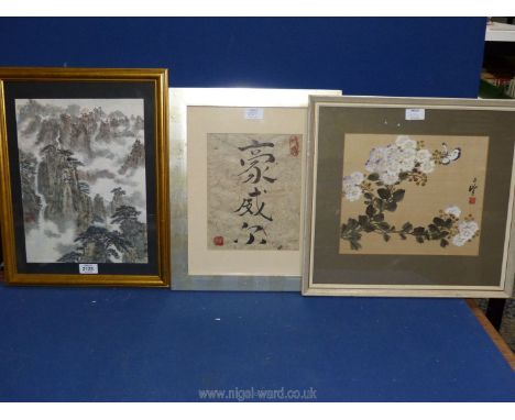 Three Oriental pictures to include a floral painting on silk, writing on hand made paper, and watercolour of a mountain and w