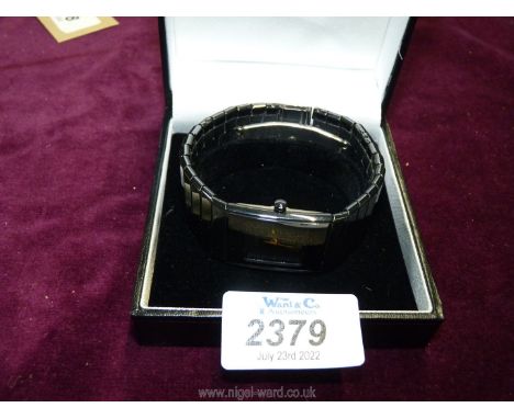 A Rado Diastar Ceramic wristwatch, square black face with gold coloured markers and hands and date panel, working at time of 
