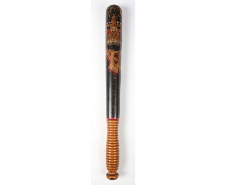 A Victorian wooden police officer's truncheon, the black-painted body with unpainted fine ring-turned handle and polychrome-d