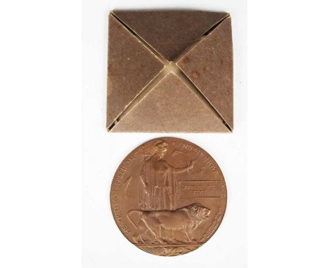 A First World War period bronze memorial plaque, detailed 'John Charles Scott', Woolwich Arsenal mark to the back, within ori