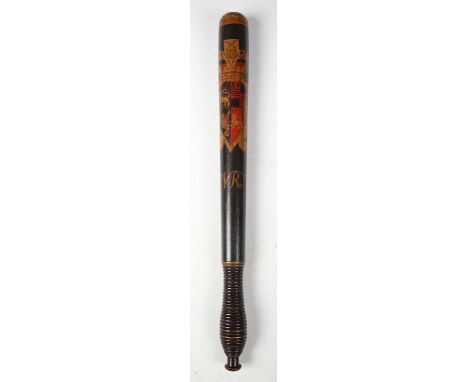 A Victorian wooden police officer's truncheon, the black-painted body with fine ring-turned grip and polychrome-decorated wit