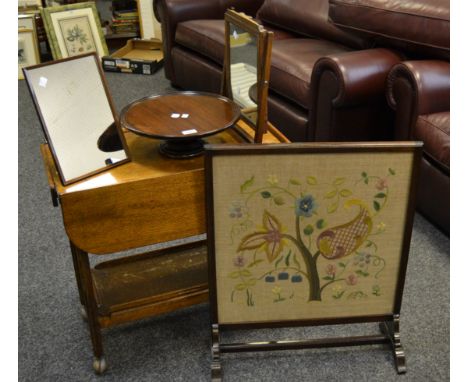 An early 20th century mahogany lazy Susan c.1930; an early 20th century crewel work mahogany fire screen; a mid 20th century 