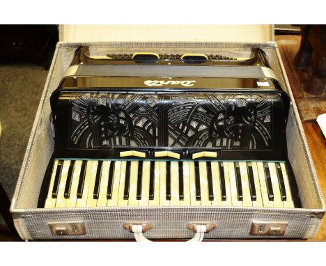 A Dante accordion, in black and ivory,  cased