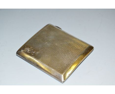 A George V silver cigarette case, engine turned with bands of chevrons, gilt interior, S Blanckensee & Sons Ltd, Birmingham 1