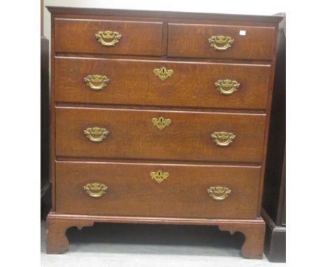An 18th century oak chest, fitted two short and three long drawers on bracket feet, 105cm high x 96cm wide  