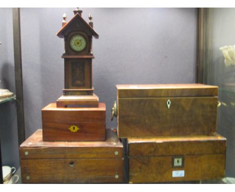 Three mahogany writing boxes, a tea caddy and a miniature longcase clock (5)  