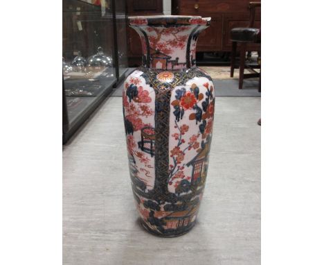 A 19th century Japanese Imari vase painted with four reserves of flowers, 50cm high  Glued back together and with some staple