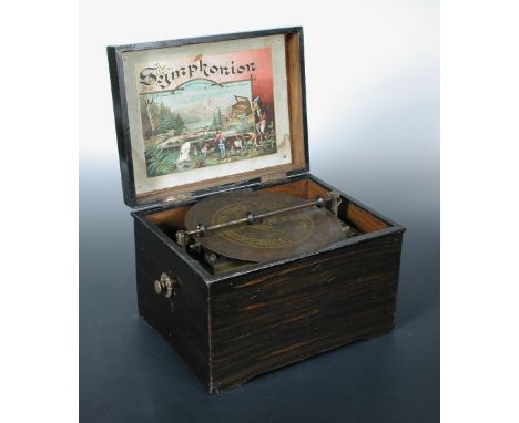 A Symphonion 19cm disc musical box, the player mechanism housed in flower printed rosewood case (worn), with nine discs, 27cm