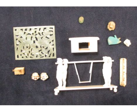 A small jade panel and various Oriental ornaments in a small burr walnut box  