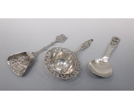 A Copenhagen caddy spoon by PF, a Dutch caddy spoon for Santa Barbara and a tea strainer (3)  