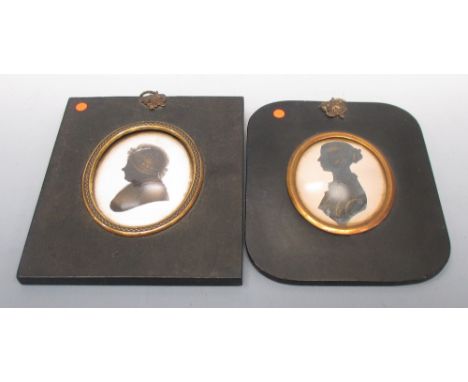 John Miers (British, 1758-1821) A silhouette of a lady and another silhouette of a lady, both with gilt details, the first of