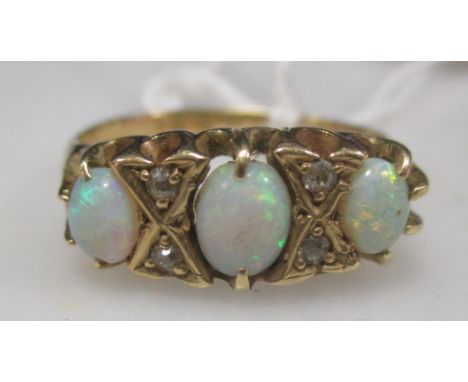 An 18ct gold opal and diamond ring  