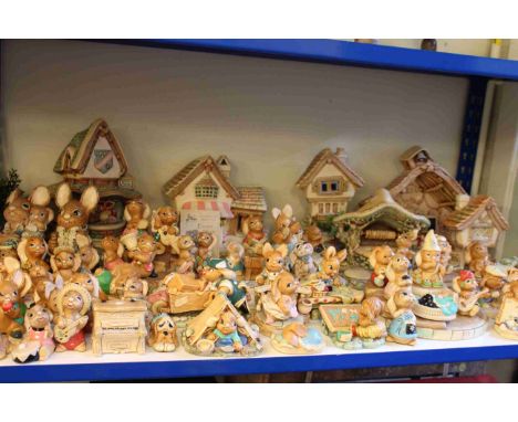 Shelf collection of Pendelfin Village and Pendelfin ornaments, approximately eight five.