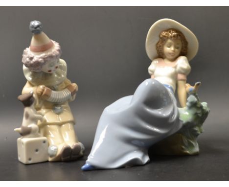 A Nao figure of a young woman with a bluebird;  a Lladro figure of a clown with a puppy (2) 