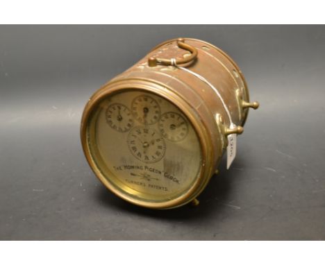 Pigeon Racing - an early 20th century Hateley's patent homing pigeon clock, the 11.5cm circular silvered register with four d