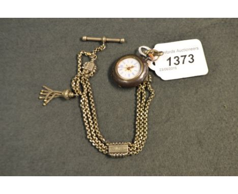 A polished steel and gilt fob watch on Albertina