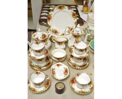 A Royal Albert Old Country Roses table service, comprising dinner plates, coffee pot, teapot, side plates, cups and saucers, 