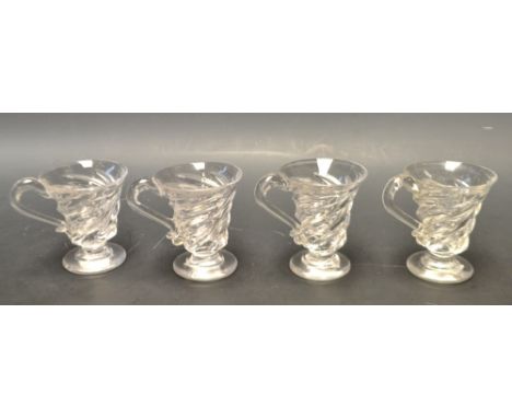 A set of four Victorian clear glass spiral custard cups