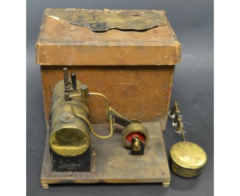 A stationary model steam engine, Product Of Mersey Model Co, Liverpool, steam powered piston drive wheel, with burner and fue