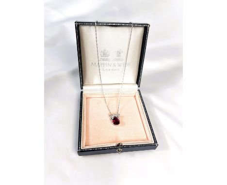 An 18 carat white gold pendant set large teardrop ruby and 6 diamonds