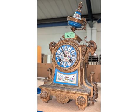 A French brass mantel clock with painted porcelain panels and face. Chiming on bell.