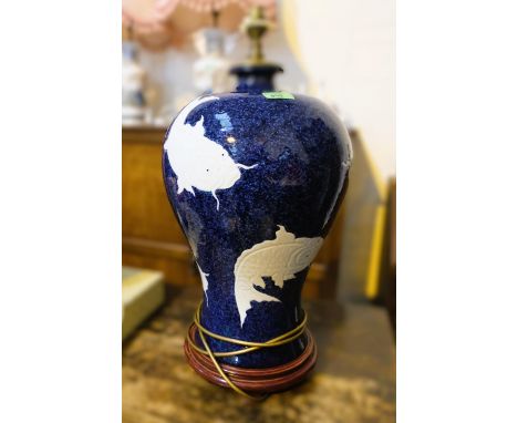 A modern inverted baluster Chinese ceramic table lamp decorated with koi carp against a blue ground. Height 48cm.