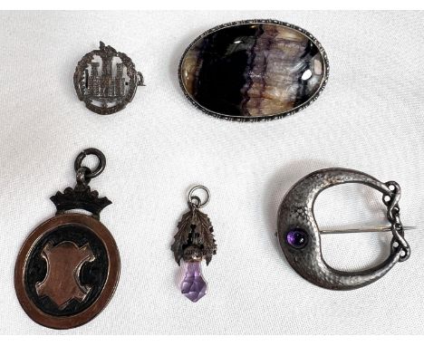 An Art Nouveau Celtic design set amethyst cabochon, stamped CYMRIC, STERLING, an oval Blue John brooch and 3 other items.