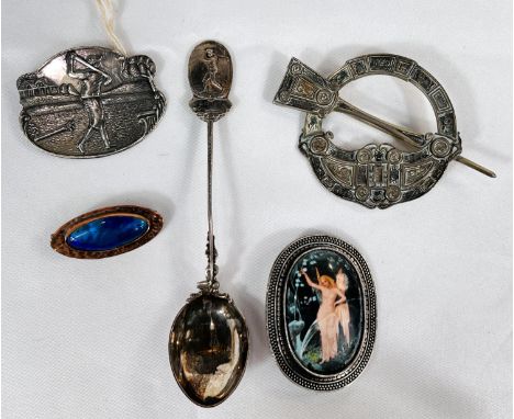 E. Johnson Dublin Celtic brooch, white metal unmarked; a silver golf brooch and silver golf spoon; a Ruskin style brooch and 
