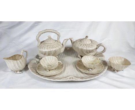 BELLEEK - a rococo style porcelain tray with a pair of cups and saucers, sugar and cream (Black printed marks), a pair of tea