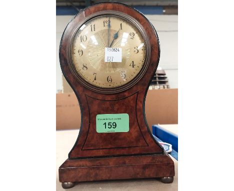 A burr walnut cased mantle clock with ebonised inlay and gilt dial.