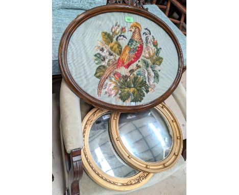 A tapestry picture of a bird in mahogany frame and a gilt framed converse mirror.
