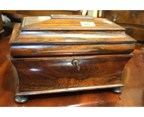 A Georgian Rosewood sarcophagus tea caddy, waisted body, stepped lid, interior glass bowl.Condition report:No interior lids, 