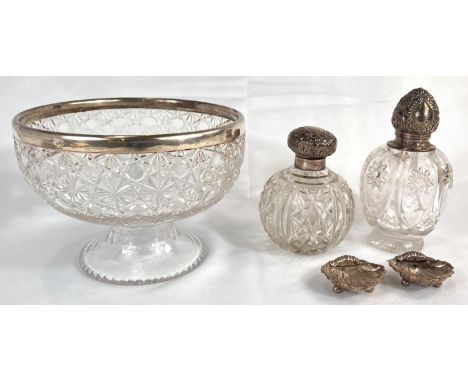 A silver topped scent bottle with cut glass body, another, a silver rimmed cut glass bowl; two silver salts and a weighted si