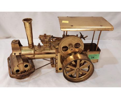 A vintage (possibly scratch built) brass steam engine.