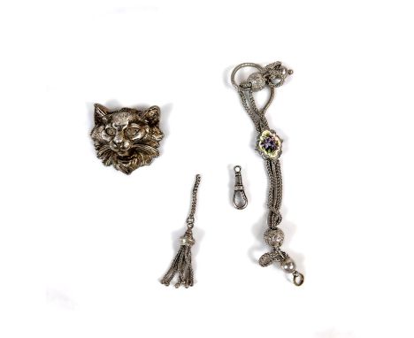 A white metal bracelet with triple woven straps joined by two engraved white metal beads and central shaped oval floral ename
