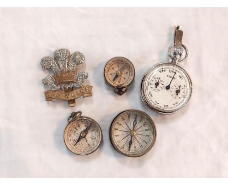 Three small vintage compasses and a military badge etc.