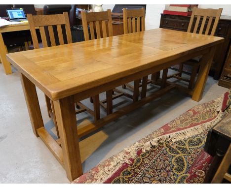 A large heavy light oak farmhouse dining table with extra leaves, single drawer under (unextended length 198cm) and 6 matchin