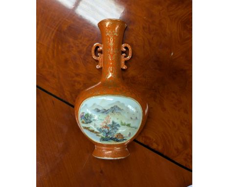 A Chinese porcelain wall pocket, orange ground with gilt highlights, polychrome panel featuring traditional country scene, ht
