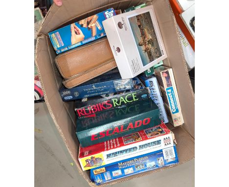 A collection of vintage board games, unopened jigsaw puzzles etc.