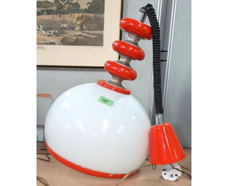 A vintage 1970's orange and opaque white rise and fall ceiling light; a novelty table lamp in the form of a 6 light flood lig