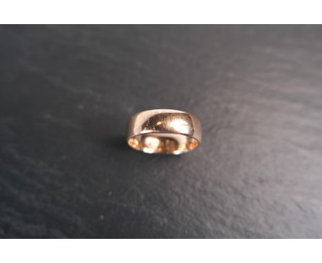 A wide barrel shaped 9 ct hallmarked gold wedding ring, 4.4 gms, size 'P' - 'Q'.