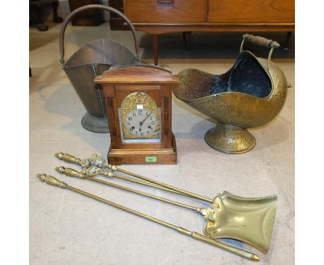 An oak cased, brass dial, mantel clock; a copper coal bucket and a brass coal bucket + a brass 3 piece companion set.