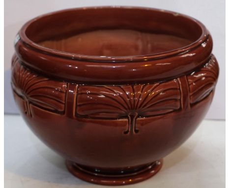 Bretby Art Pottery: -&nbsp; A circular jardiniere on raised foot with relief decoration of stylized fans, diameter 26cm, unde