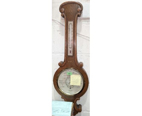 An oak cased aneroid barometer with thermometer (glass a/f);a set of brass and iron kitchen scales; a&nbsp;pair of Prinz 10x5