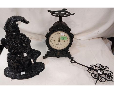 A 19th Century Mr Punch doorstop; a vintage household scales, flat irons etc.