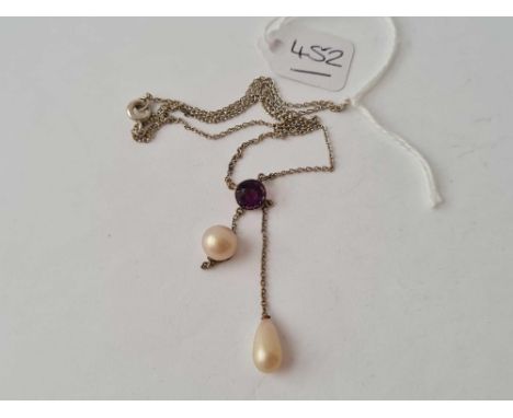 A amethyst and pearl drop necklace set in white metal 