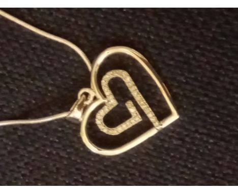 A large silver heart pendant set with diamonds on silver chain with certificate 6.3g inc