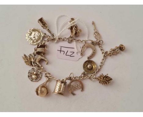 A vintage silver charm bracelet - 24.5 gms 